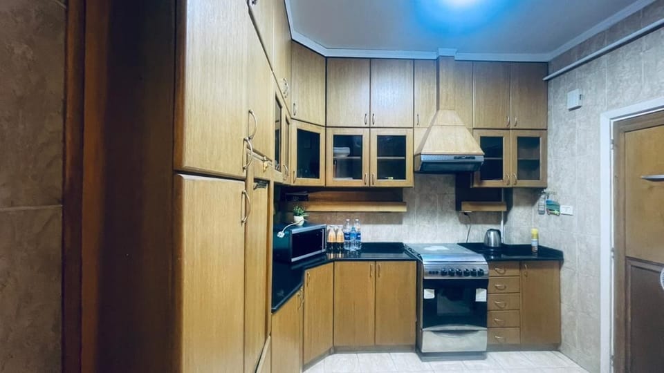 Luxury Apartment | Private kitchen | Shared fridge, dining tables
