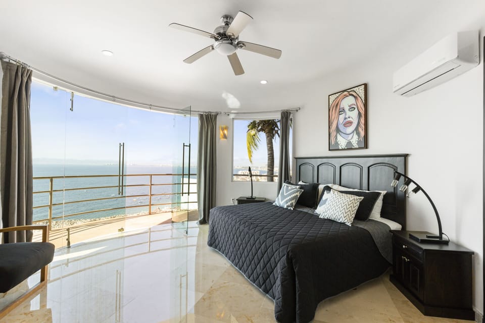 Main King Bedroom with spectacular view, veranda & "Moira Rose" art work