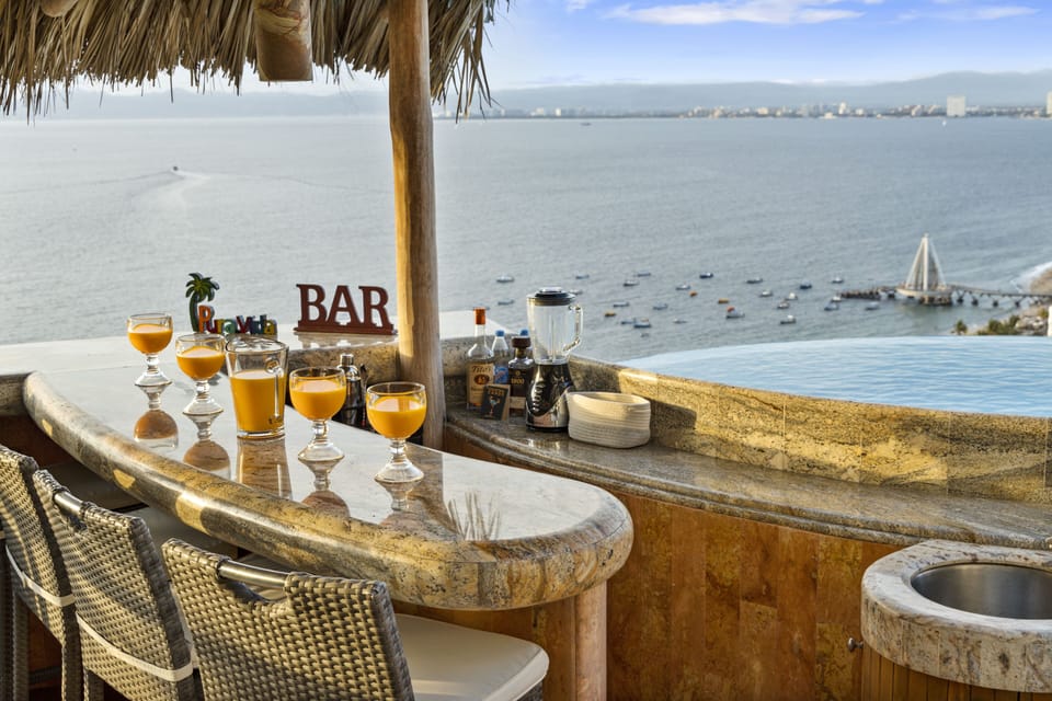 Drinks at sunset from the palapa bar overlooking PV