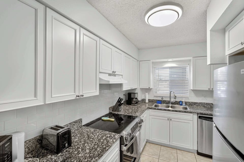 Prepare to be delighted by the bright and inviting kitchen, designed for both functionality and style. 