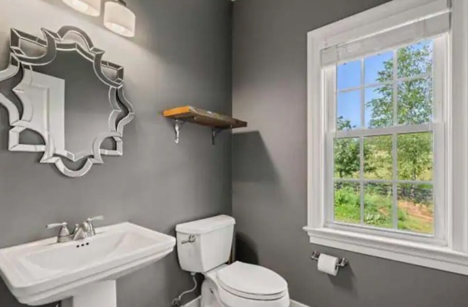 Main level half bath located near front entrance.
