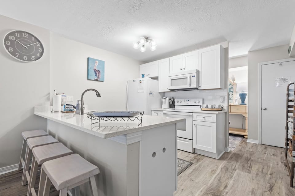 Fully equipped kitchen with modern appliances—perfect for home-cooked meals.