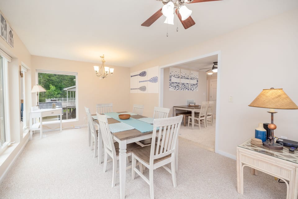 The dining area provides a picturesque view of the lake.