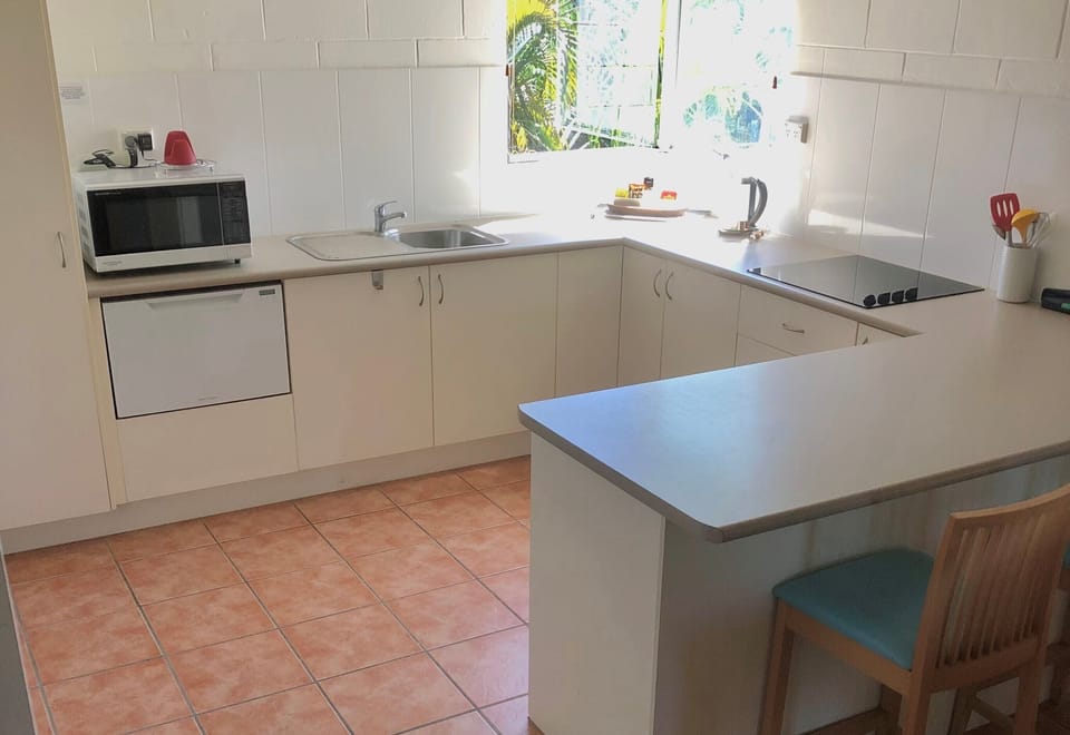 Spacious kitchen includes cook top, microwave and dishwasher