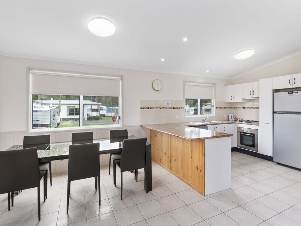 Deluxe 2 Bedroom Cabin | Living area | TV, table tennis