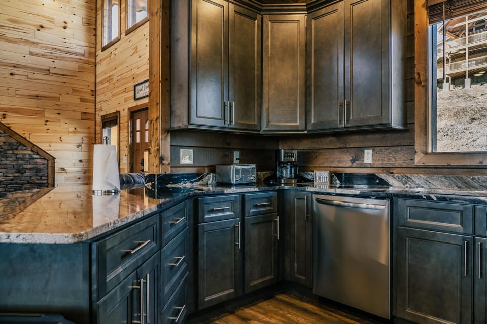 Fully furnished kitchen with stainless steel appliances. 
