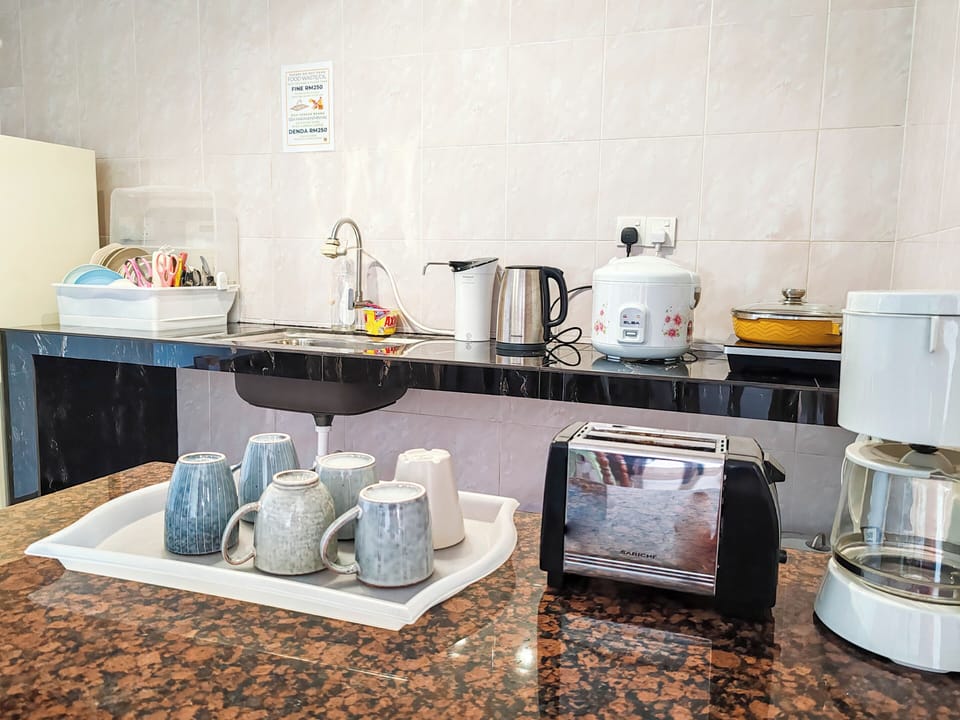 Executive Condo | Private kitchen | Full-size fridge, stovetop, cookware/dishes/utensils, cleaning supplies