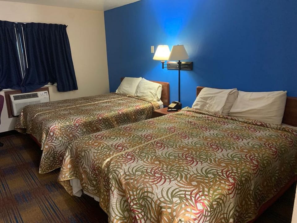 Economy Quadruple Room, 2 Queen Beds, Non Smoking | Individually decorated, individually furnished, free WiFi, bed sheets