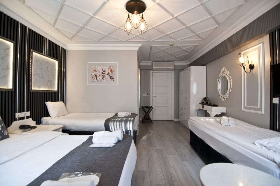 Family Room | Minibar, in-room safe, desk, laptop workspace
