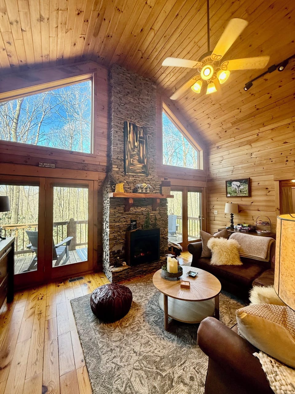 Cozy up in front of the soaring fireplace on the comfortable couch.