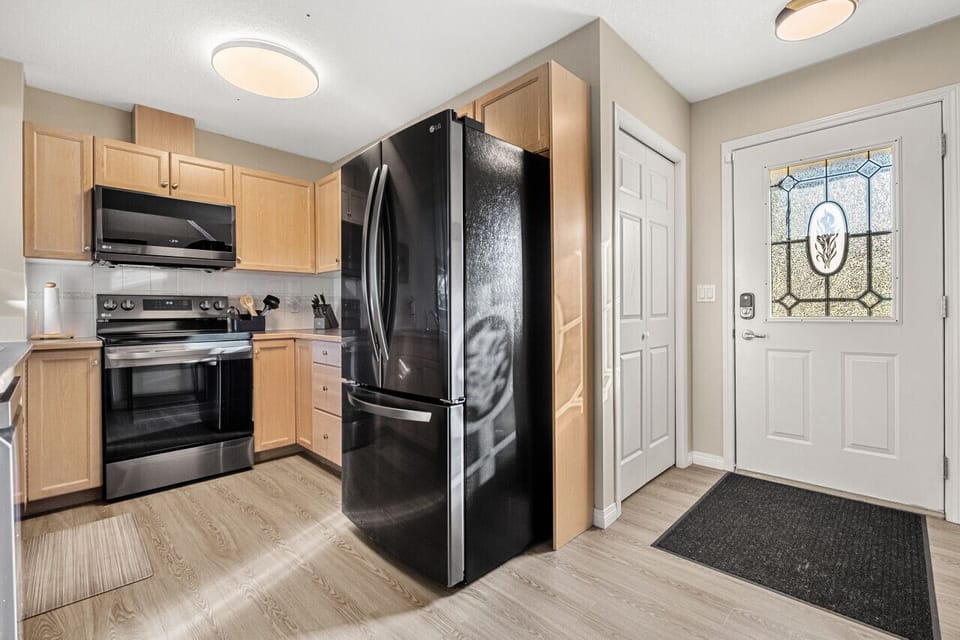 Full kitchen with a drip coffee maker, ground coffee, tea, sugar and condiments (ketchup/mustard/relish.)