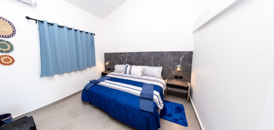 Comfort Room, Ensuite, Beach View | 1 bedroom, in-room safe, bed sheets