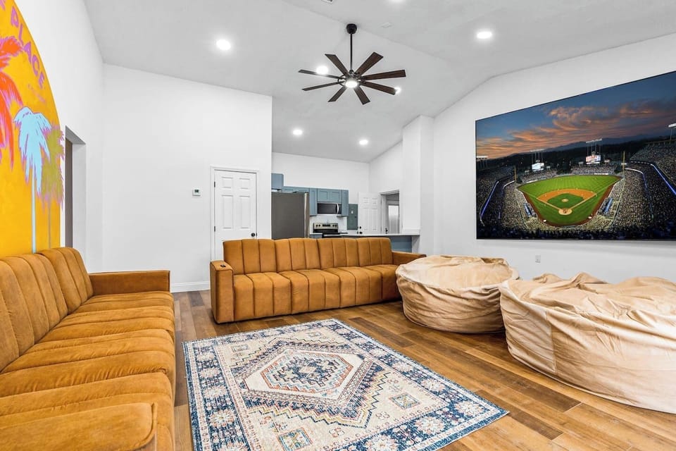 Game Room with 150-inch Screen open to Heated Salt Water Pool 