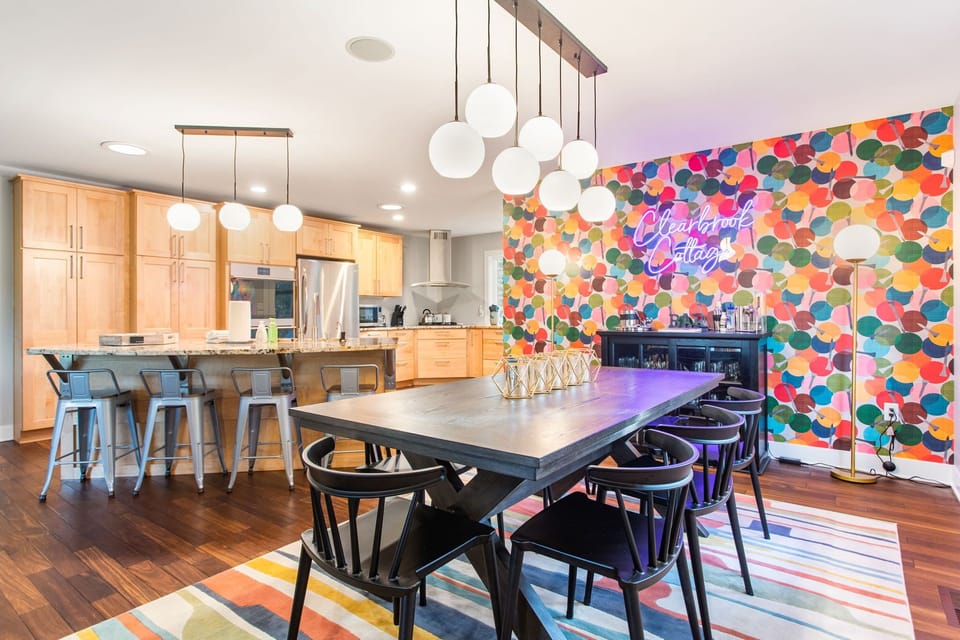 Dining with seating for 8 and kitchen area with island seating for 4