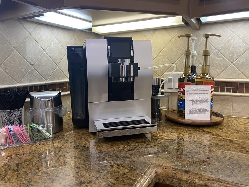 Jura Super-Automatic espresso machine makes espresso, coffee, latte, macchiato, flat white, steamed milk at the push of a button!  We supply dark roast beans.