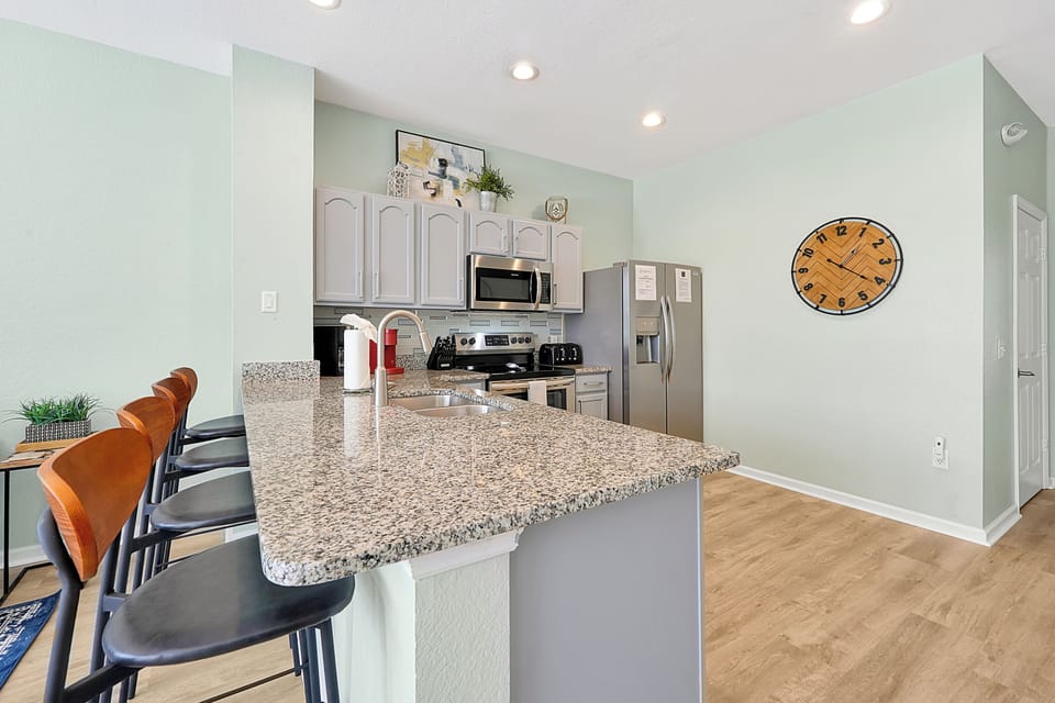 Feel Connected To Everyone While Cooking In The Open Concept Kitchen, Living and Dining Area