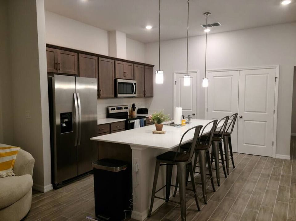 Bright and open kitchen next to living room