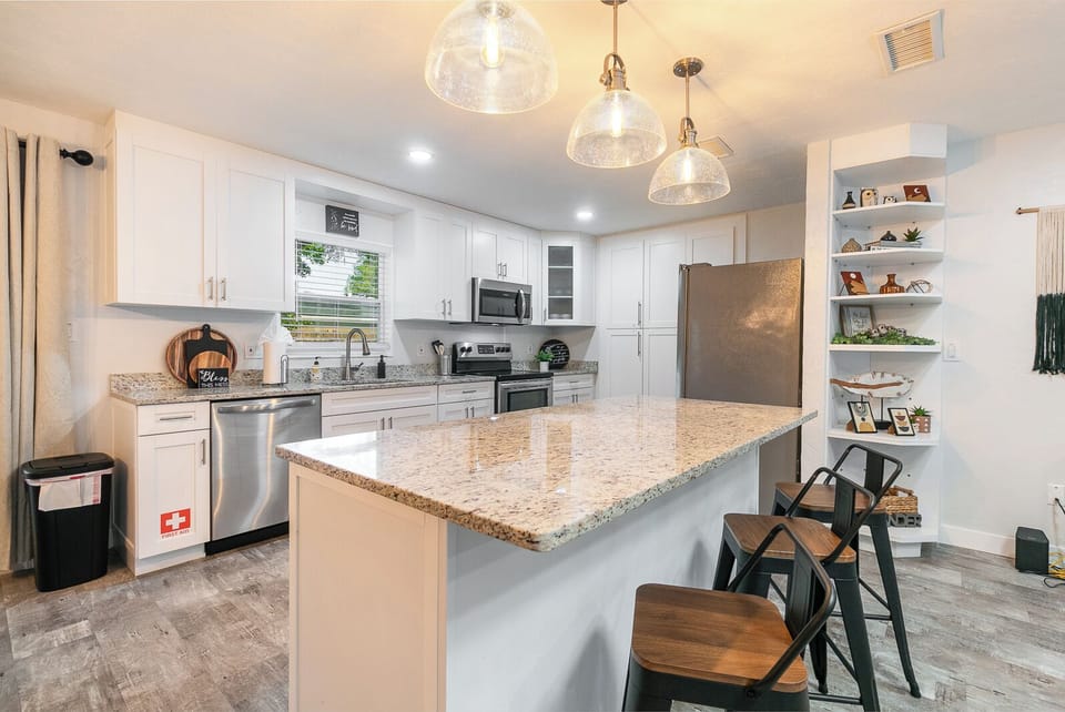 The island serves purposes such as extra cooking or eating space.