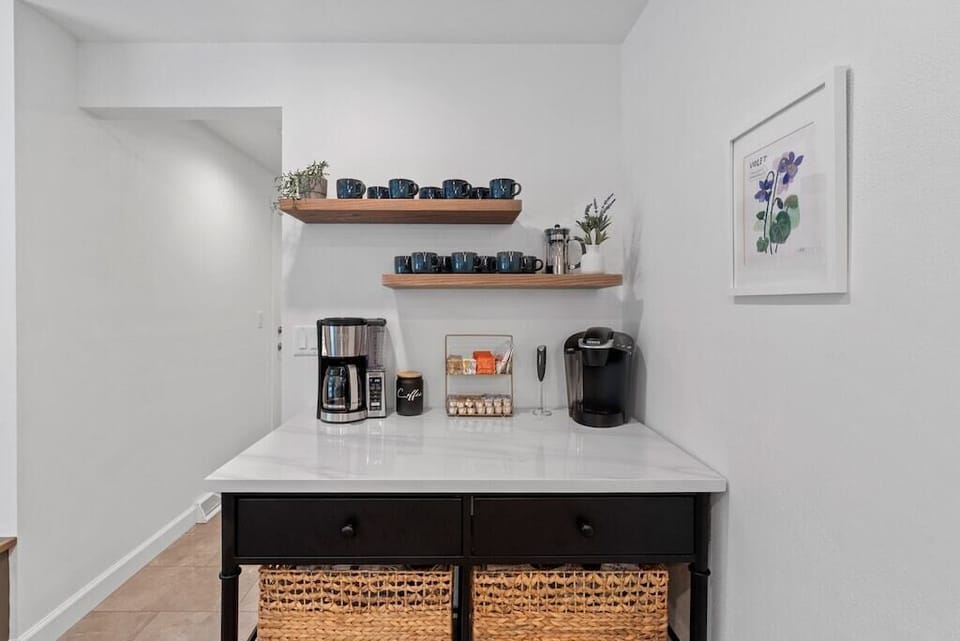 Coffee bar stocked for both single pods & full pot brewing.