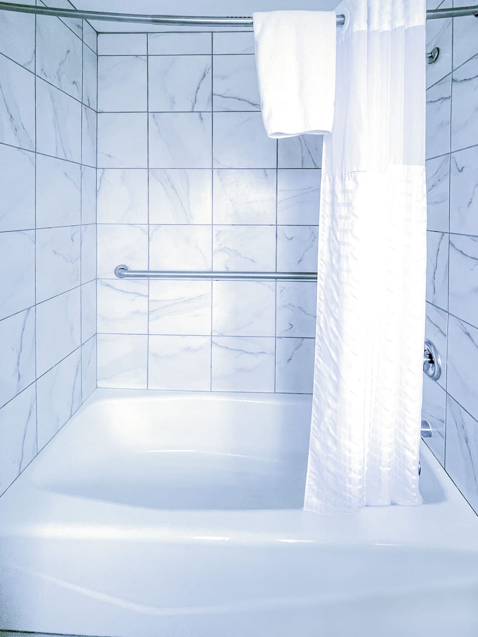 Standard Two Queen | Bathroom | Hair dryer, slippers, towels, soap