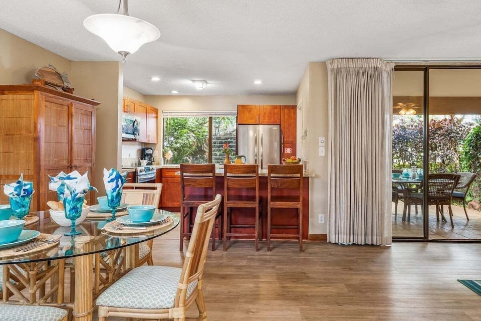 A warm dining space with wood accents and easy access to the kitchen, perfect for shared meals and family gatherings.