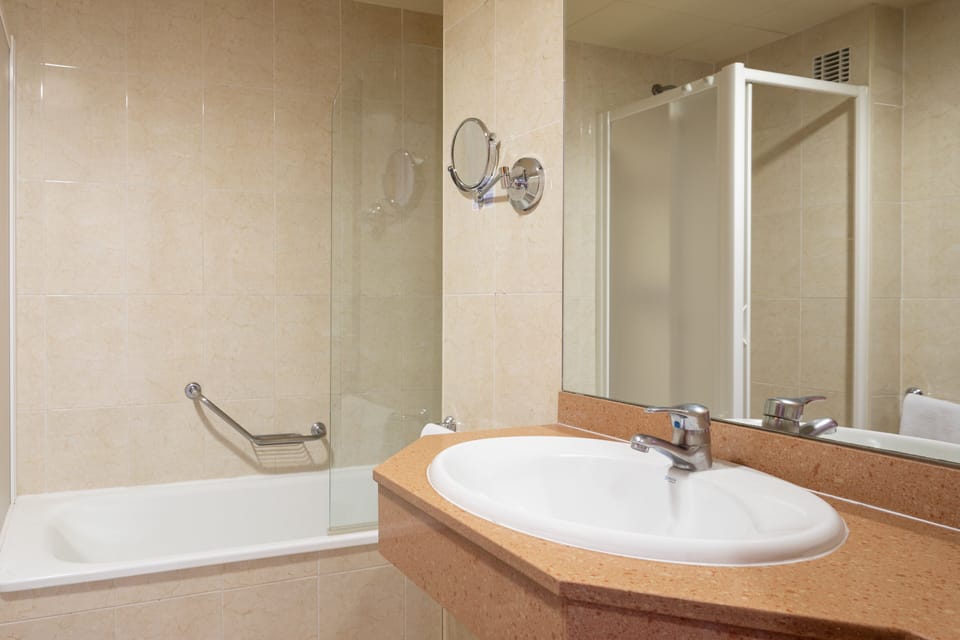 Bathtub, hair dryer, towels