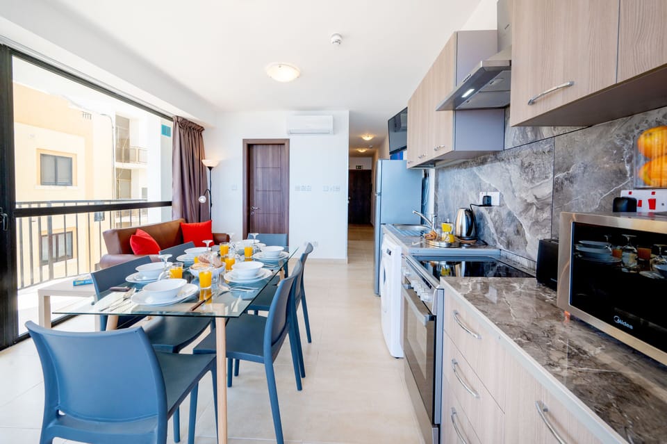 Standard Apartment | Living area | 43-cm LCD TV with satellite channels, TV