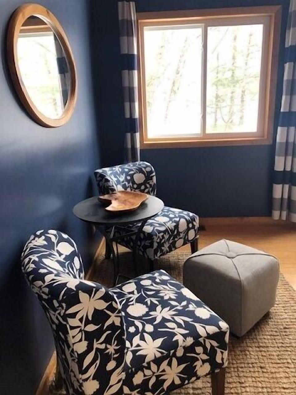 Cozy sitting area in main bedroom with window that overlooks the lake