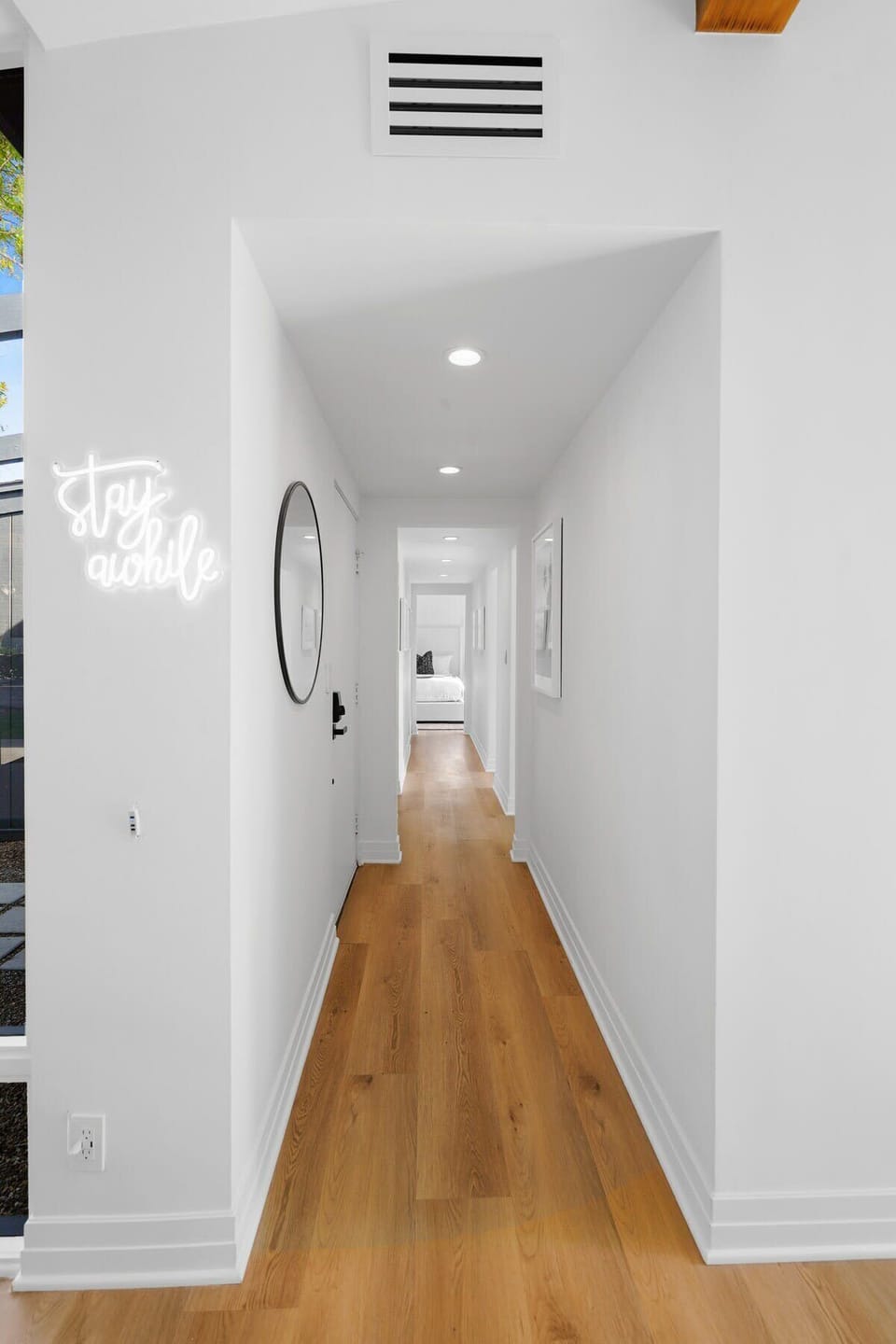 Beautiful hallway filled with latest beach artwork.