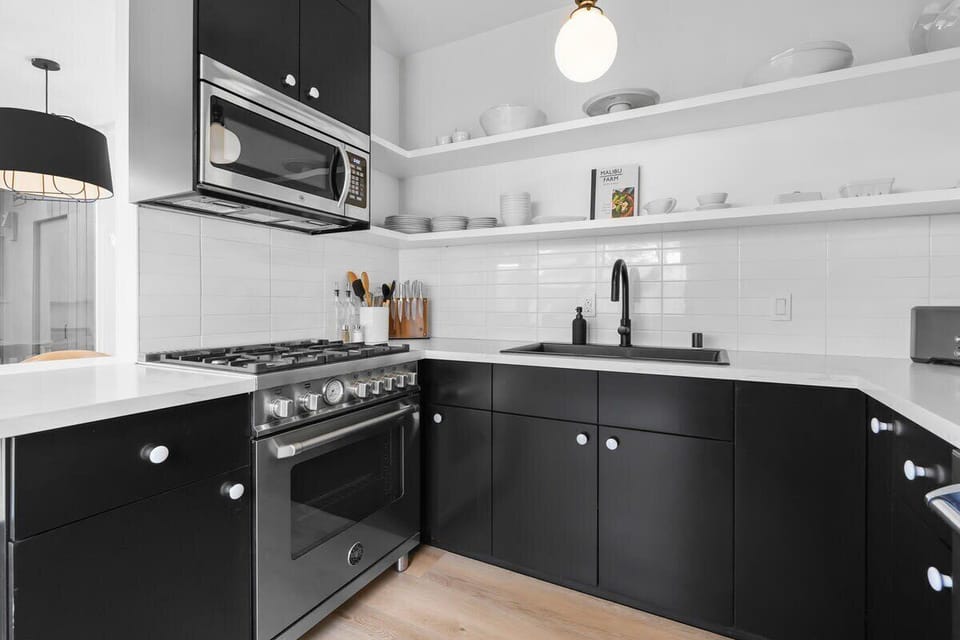 European style kitchen awaits you.  Fully stocked kitchen with all high-end appliances, dinnerware, flatware, drinkware, 2 coffee systems, and chef preferred gadgets for baking and cocktail making.