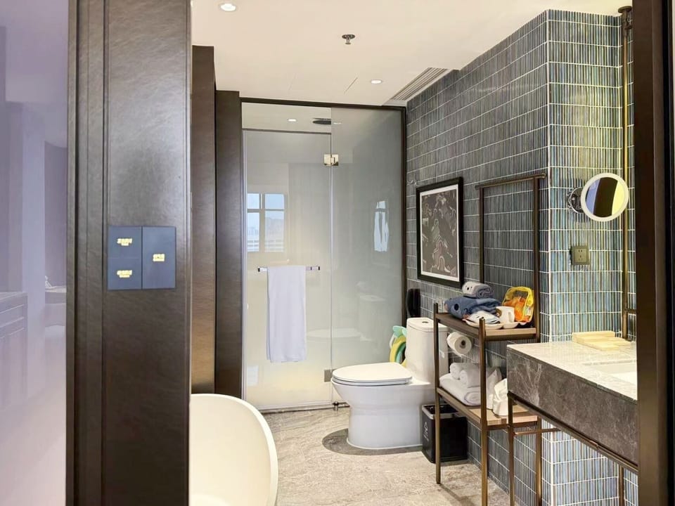 Deluxe VIP Family Friendly Double Room | Bathroom | Combined shower/tub, free toiletries, hair dryer, bathrobes
