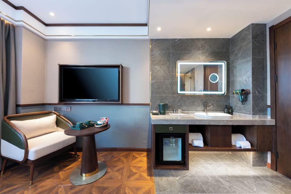Basic Double Room | Living area | 55-inch LED TV with cable channels