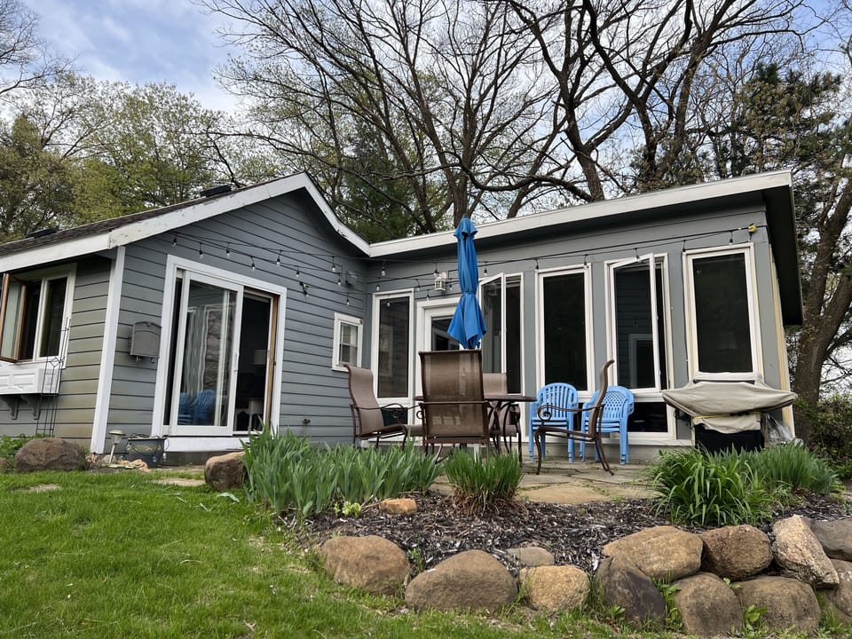 Patio set with dining for 4 and additional seating, propane grill, and lights