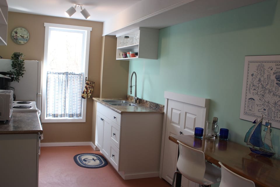Kitchen is fully equipped for you., including pots/pans, baking sheets, Keurig