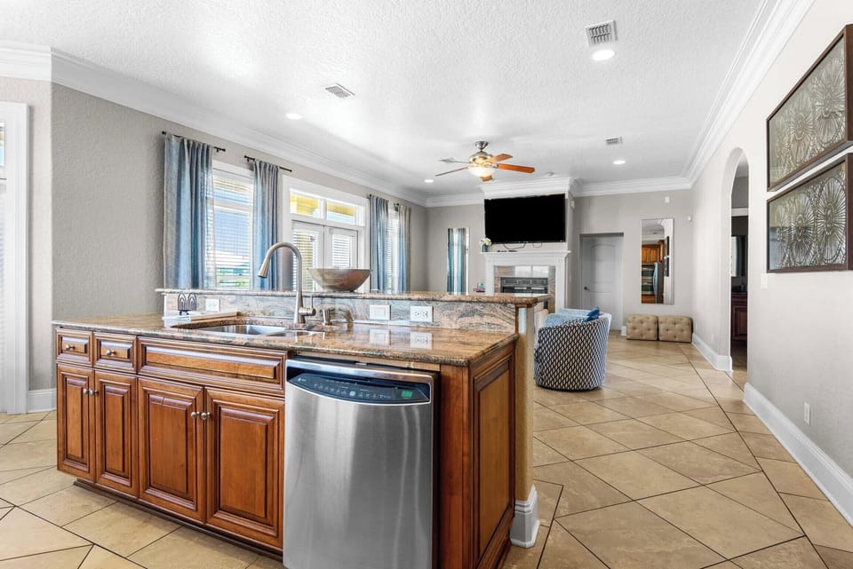 Full kitchen with a view of the living room