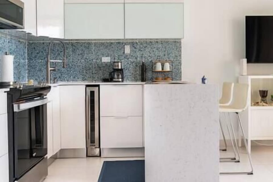 New kitchen with built in wine fridge.
