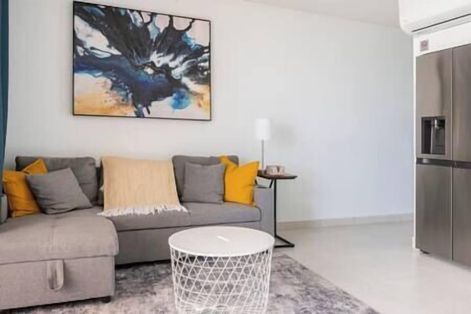Living room with sleeper sofa. clack out curtains for privacy.