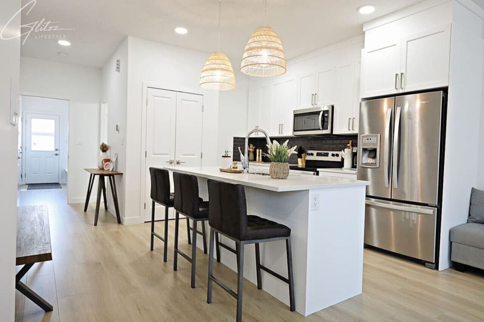 Whip up your favorite meals in this stunning, sun-filled kitchen.