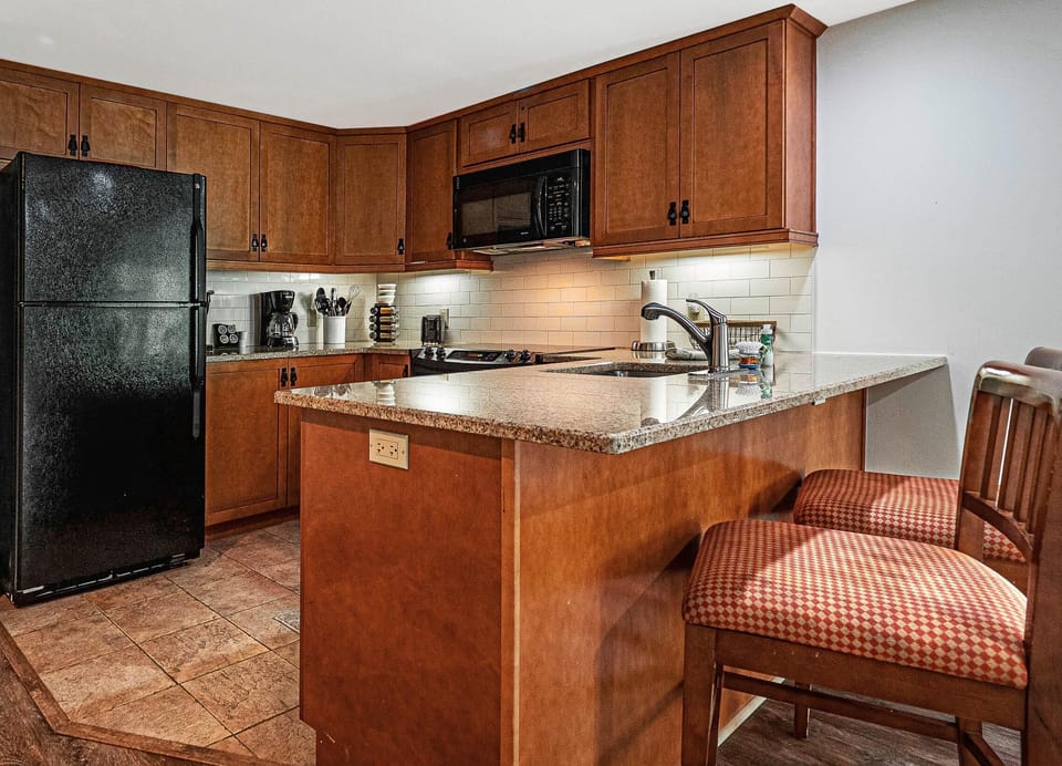 Full kitchen with a full size fridge