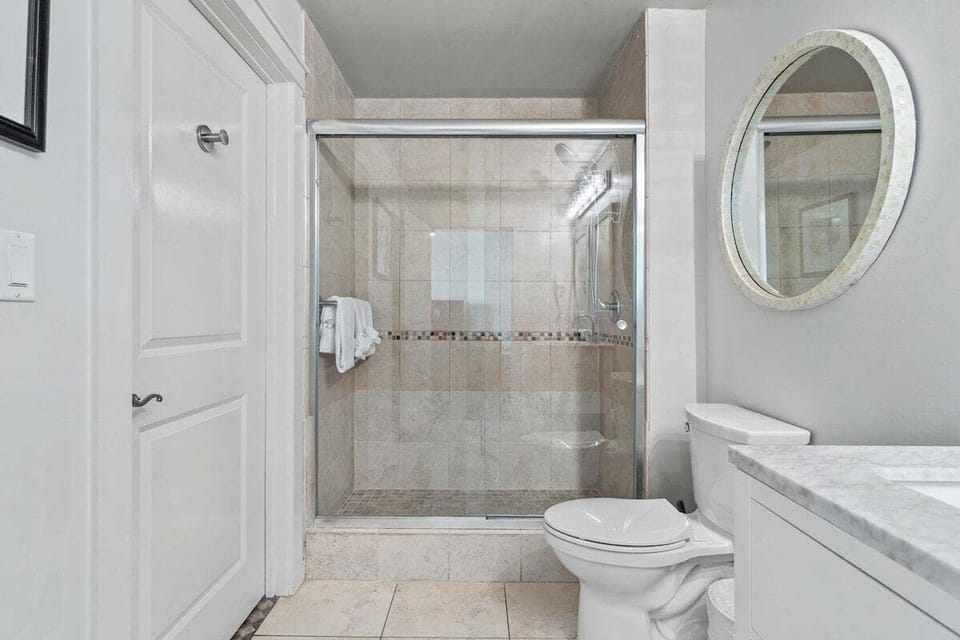 Bathroom with walk in tiled shower