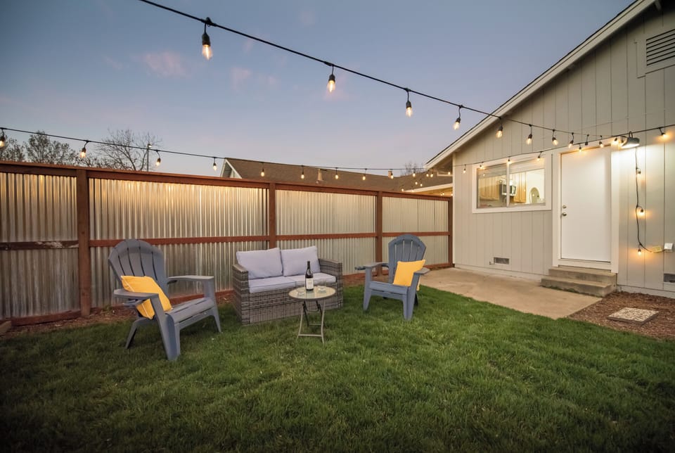 Open and incredible backyard with bistro lights