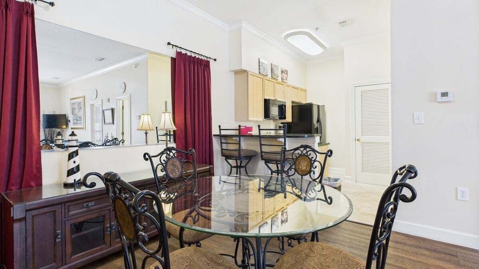 Dining table in main living area that seats 4