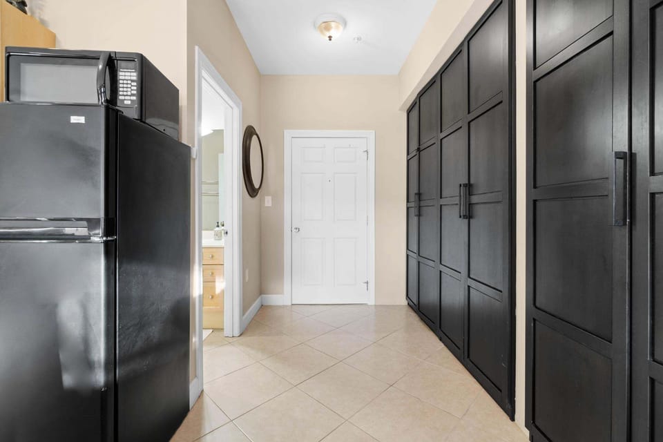 Entry-way to unit with entry to the bathroom