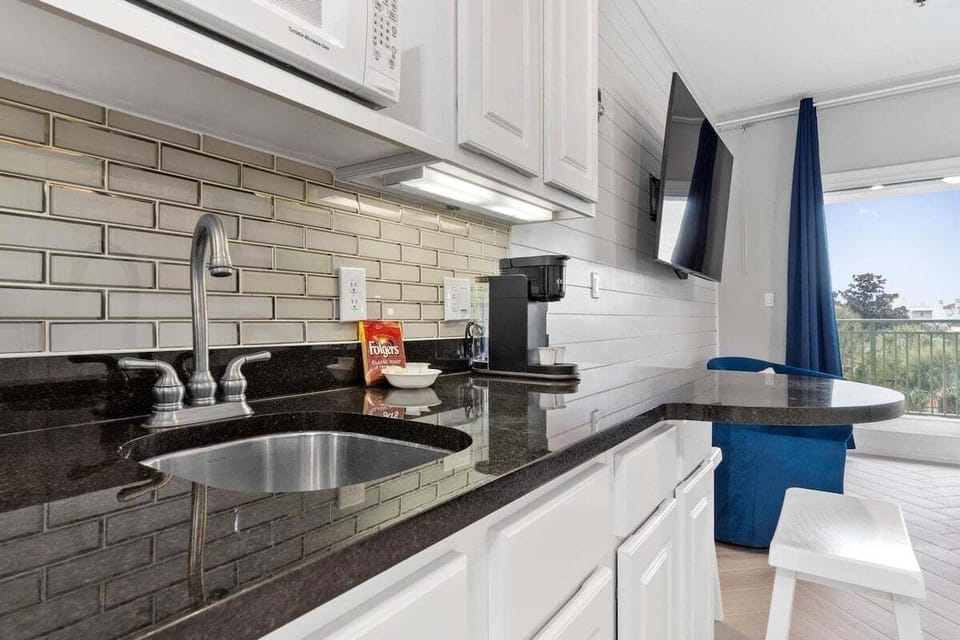 Kitchenette with seating area and full size refrigerator