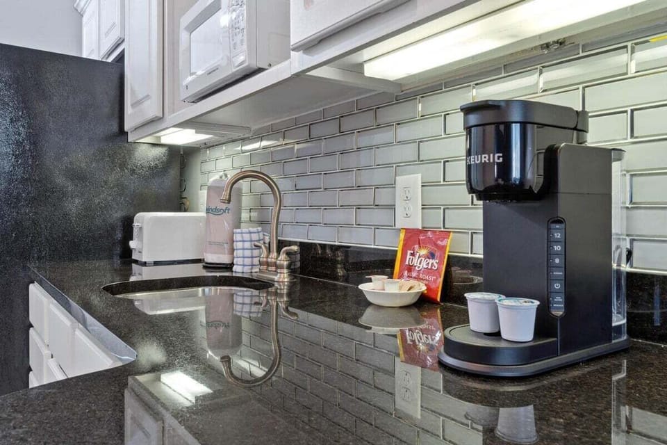 Kitchenette with seating area and full size refrigerator