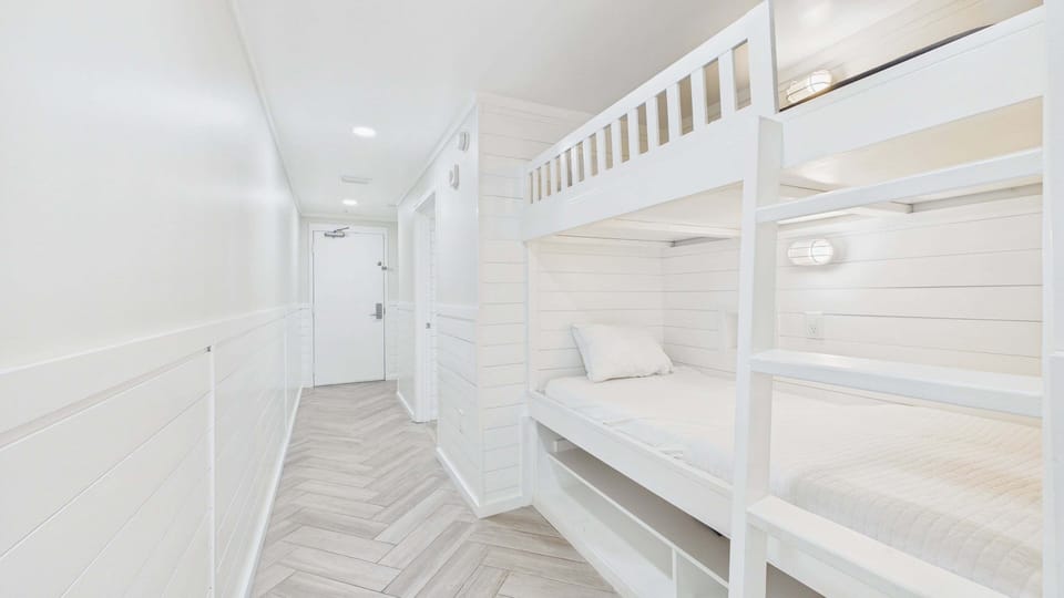 Bunk nook in hallway with twin-over-twin bunk beds - TVs in each bunk!