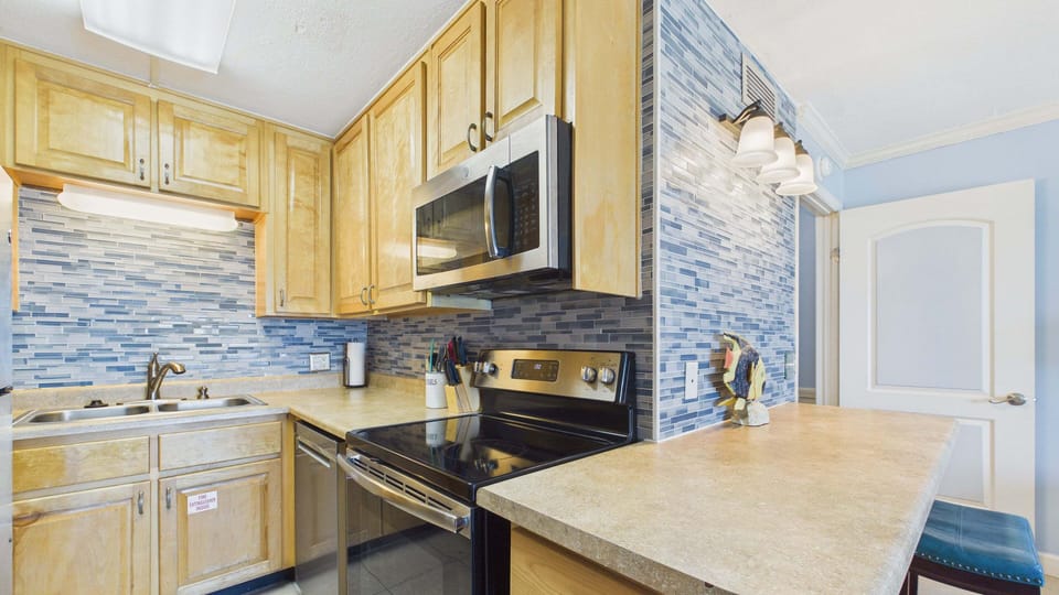 Full kitchen with NEW appliances and all the cooking essentials for your stay