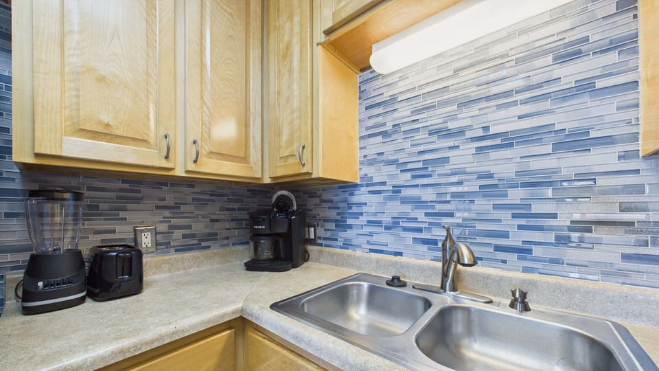 Kitchen equipped with coffee essentials and misc amenities