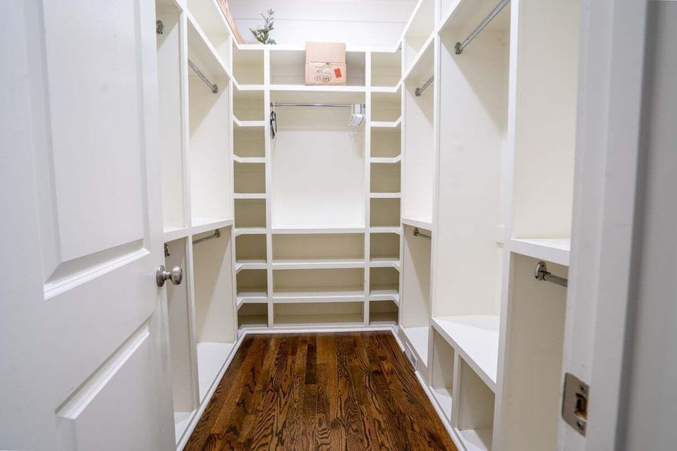 Primary bedroom walk in closet