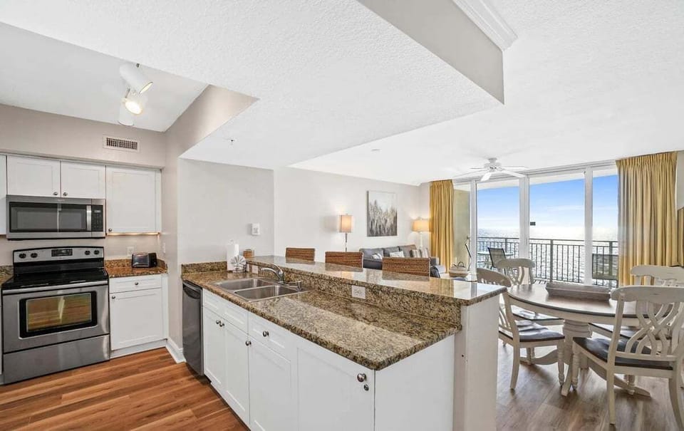 Full kitchen with all the cooking essentials and breakfast bar